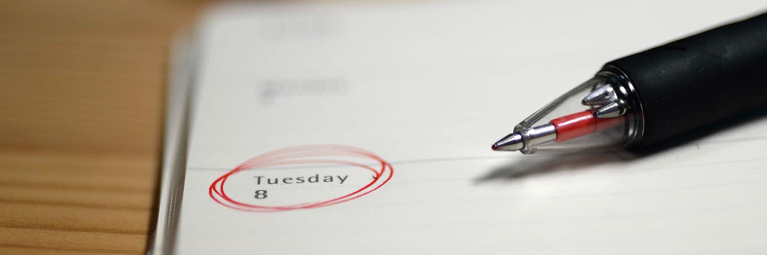 Image of a pen circling a date for an appointment.