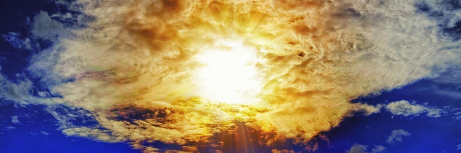 Sunlight bursting through clouds in the sky.