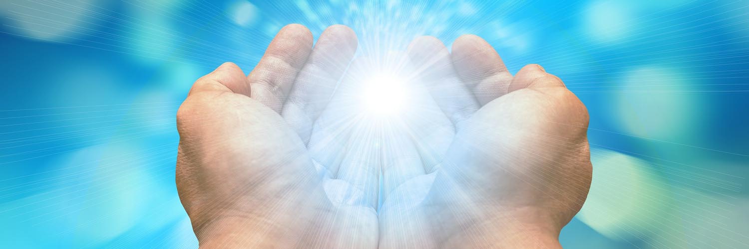 Image of hands with energy for healing in the palms.